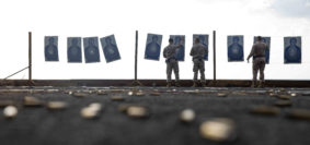 USS MAKIN ISLAND, Gulf of Aden (Jan. 19, 2017) U.S Marines with Combat Logistics Detachment 111, Combat Logistics Battalion 11, 11th Marine Expeditionary Unit, straiten tilted targets during a live-fire range or “deck shoot” aboard the USS Makin Island (LHD 8), Jan. 19. The range allowed the Marines to practice their marksmanship skills while deployed aboard the USS Makin Island. (ph U.S. Marine Corps/ Cpl. April L. Price)