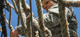 Army Sgt. Amanda Spear descends a rope ladder on the obstacle course for the Indiana National Guard Best Warrior Competition at Camp Atterbury, Ind., March 4, 2017. Spear is assigned to the 638th Aviation Support Battalion. During the event, soldiers needed to demonstrate proficiency in warrior tasks and skills, including marksmanship, emergency first aid and land navigation. Army National Guard photo by Sgt. Evan Myers