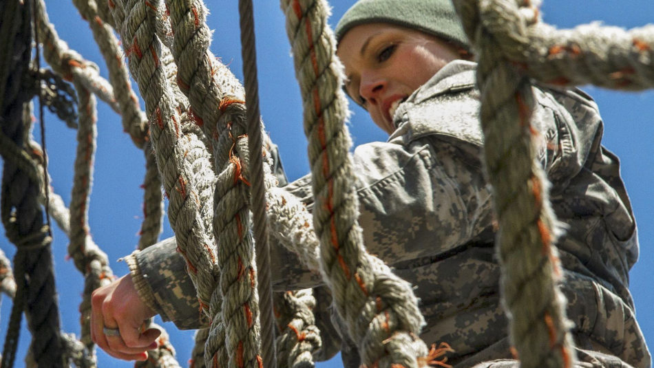 Army Sgt. Amanda Spear descends a rope ladder on the obstacle course for the Indiana National Guard Best Warrior Competition at Camp Atterbury, Ind., March 4, 2017. Spear is assigned to the 638th Aviation Support Battalion. During the event, soldiers needed to demonstrate proficiency in warrior tasks and skills, including marksmanship, emergency first aid and land navigation. Army National Guard photo by Sgt. Evan Myers