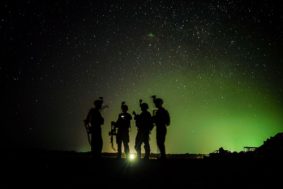 U.S. Army Soldiers from Easy Company, 101st Airborne Division (Air Assault), stand by for their night guard shift in Kenya, Jan. 20, 2020. Soldiers from the 101st Airborne Division are assigned to the East Africa Response Force and provide the ability to rapidly respond to events spanning a vast area of responsibility. (U.S. Air Force photo by Staff Sgt. Shawn White)