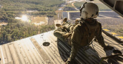 U.S. Marine Corps Cpl. Michael A. Culbertson, crew chief, Marine Aircraft Group 29, 2nd Marine Aircraft Wing, observes the terrain during the flight back to Marine Corps Air Station (MCAS) New River after participating in a mishap training at Wilmington International Airport in Wrightsboro, North Carolina, Dec. 14, 2023. Marines with MCAS New River and Marine Operational Test and Evaluation Squadron 1 integrated with civilian first responders from New Hanover County to conduct a military aircraft mishap training to enhance emergency response skills between civilian and military first responders. (U.S. Marine Corps photo by Lance Cpl. Alyssa J. Deputee)